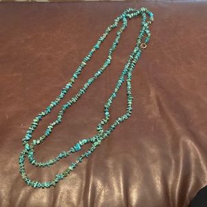 Treated turquoise layering necklace. About 82 inches long.